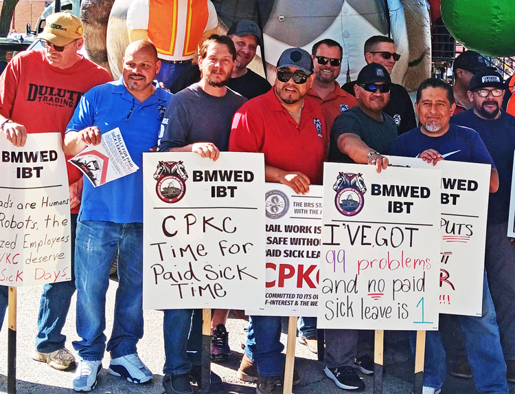 Brotherhood of Maintenance of Way workers picket at Canadian Pacific Kansas City community steam train event in Franklin Park, Illinois, May 8, in fight for paid sick leave.