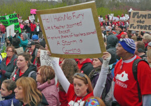 Kentucky teachers walk out in protest in April 2018 inspired by victory two months earlier in West Virginia by teachers, bus drivers, cafeteria workers, who won raises for all state employees. Actions pointed to social movement needed to fight for interests of all working people.