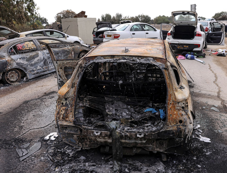 Aftermath of Hamas’ slaughter of 370 Jews and others at Nova music festival in Israel, part of Oct. 7 pogrom that killed 1,200 people overall. More than 40 of the hostages Hamas seized were at the festival. “Everything we do is justified,” says Hamas leader Ghazi Hamad, inset.
