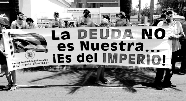 Banner in Puerto Rico, 2017: “The debt is not ours, it’s the empire’s!” Inset, Fidel Castro speaking Aug. 3, 1985, at “continental dialogue” in Havana, advancing campaign to demand foreign debt of the entire Third World be canceled. It is unpayable, and immoral, given the exploitation of semi-colonial countries by imperialism, he said.