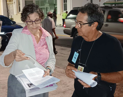 Rachele Fruit, SWP candidate for president, speaks with cruise ship porter Jorge Pineda while campaigning outside International Longshoremen’s Association union hall in Miami May 4. 