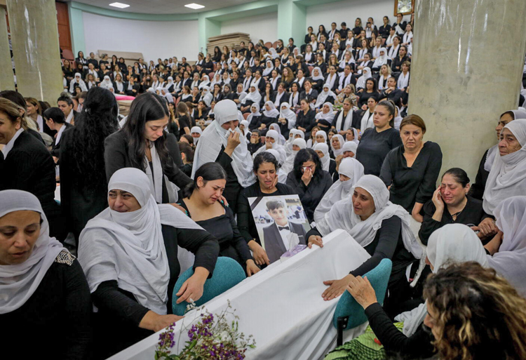 Family, friends at July 28 funeral for 12 Druze children killed day before by Hezbollah missile from Lebanon that hit soccer field in Majdal Shams in Israeli-ruled Golan Heights.