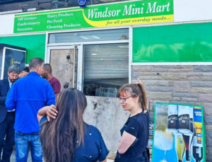 “The support from strangers is unbelievable,” said Chanaka Balasuriya, a Sri Lankan, at his shop in Southport. Workers came to help fix shop up after looting by anti-immigrant rioters.