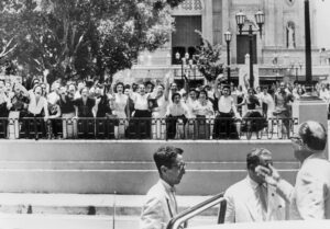 Women in Santiago de Cuba protest U.S. Ambassador Earl Smith, right, in July 1957, demand an end to U.S. support for Batista dictatorship. Women joined revolutionary movement led by Fidel Castro, and after Jan. 1, 1959, victory they helped lead advance of socialist revolution.