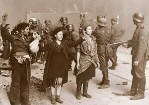 Jewish resistance fighters captured by Nazi stormtroopers during 1943 Warsaw Ghetto Uprising. This heroic rebellion was first and largest act of armed resistance against Holocaust.