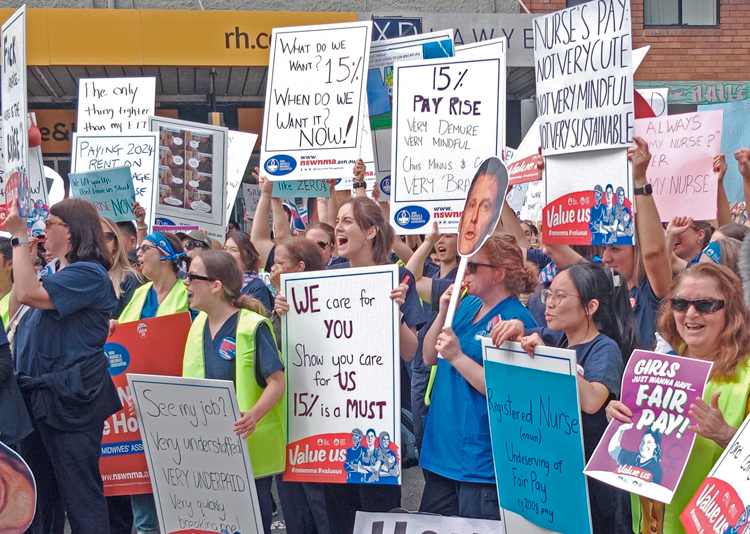 Some 2,000 nurses and midwives rally in Sydney, Australia, Sept. 10, part of 12-hour strike there and other cities in New South Wales state, demanding 15% wage raise, reduced hours.