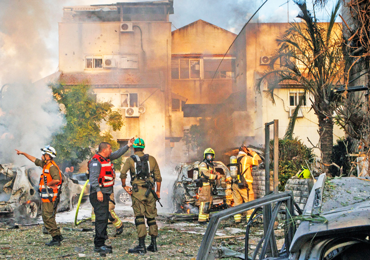 Israeli rescuers at houses hit by Hezbollah rocket in Kiryat Bialik, northern Israel, Sept. 22. Daily missile attacks from Lebanon by Tehran-sponsored terror group target Jewish civilians.