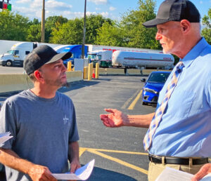 Nelson Salgado, left, at truck stop in Paulsboro, New Jersey, Sept. 22, told Dennis Richter, SWP candidate for vice president, that he agreed with him that workers need to take power.