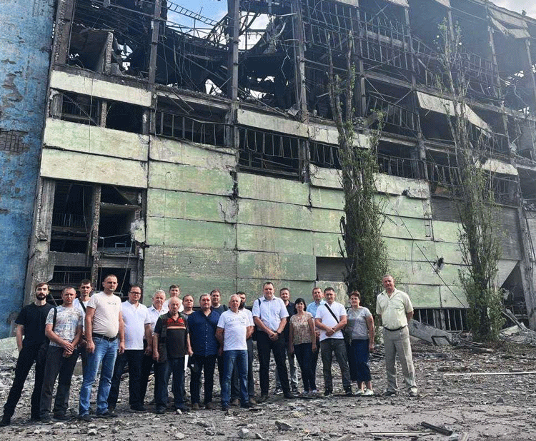 Workers from Independent Trade Union of Miners of Ukraine at damaged Kapitalna coal mine in Ukraine’s southeast Donetsk region. Russian missile attack Aug. 6 injured several miners.