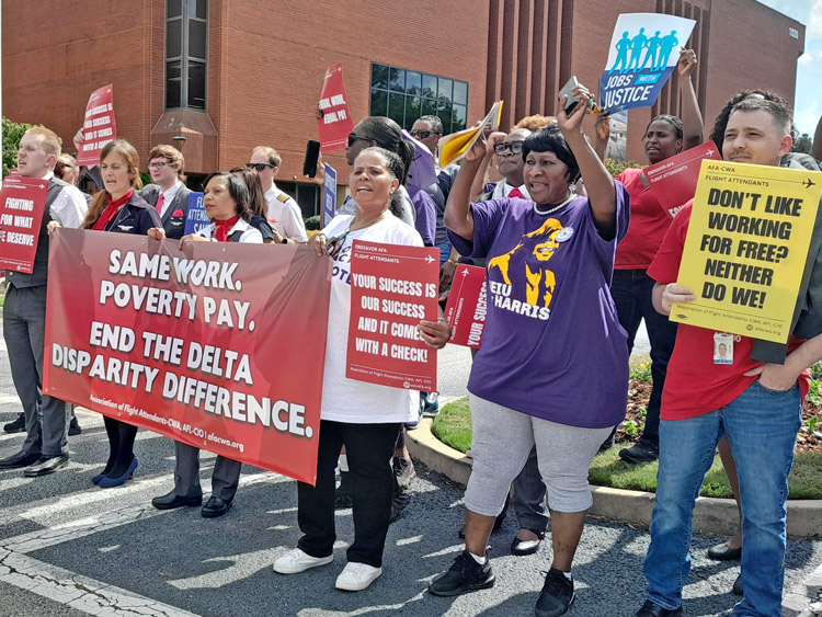 Endeavor Air flight attendants and supporters protest at Delta Air Lines headquarters in Hapeville, Georgia, Oct. 3, demanding equal pay with Delta flight attendants, improved conditions.