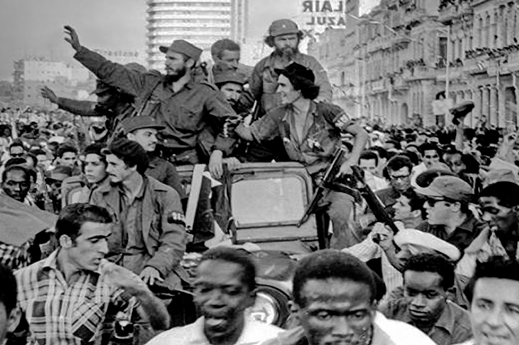 Fidel Castro, center, waving, led Liberty Caravan into Havana Jan. 8, 1959, after Rebel Army ousted U.S.-backed dictator Batista a week earlier. As Castro led Cuban workers, peasants in making a socialist revolution, U.S. rulers launched a decadeslong economic war against Cuba.