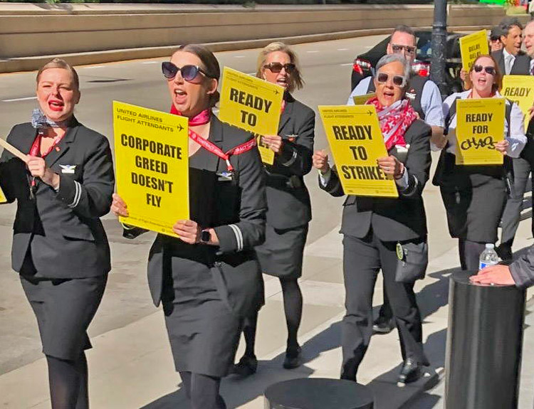 Members of Association of Flight Attendants-CWA, supporters picket United Airlines headquarters in Chicago Oct. 17 in fight for contract, sizable wage raise, pay for all time worked.