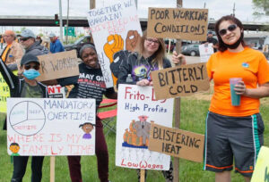 Workers at Frito-Lay in Topeka, Kansas, May 2021, demand better job conditions and end to forced overtime. Capitalists obtain labor they need “with callous indifference to our health, safety or the needs of our families,” says Mary-Alice Waters. “Then, like the ‘merchants of beauty,’ they sell the products of our labor back to us, reaping enormous profits.”