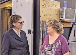 Rachele Fruit, left, SWP candidate for president, speaks with Polly Augenstein Oct. 18. Coming from Pittsburgh, she is staffing free shower, laundry facilities in Swannanoa, North Carolina.