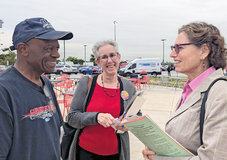 Rachele Fruit, SWP candidate for president, right, speaks to trucker at New Jersey Turnpike truck stop Sept. 27, accompanied by Joanne Kuniansky, SWP candidate for U.S. Senate in N.J.