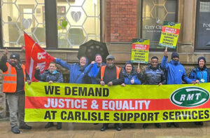 Manchester Carlisle Support Services rail workers, who check tickets on Northern Trains, in strike protest Jan. 27, one of many over years. They won broad support from other rail workers.