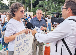 Rachele Fruit, left, SWP candidate for president, is interviewed by press at Holocaust Memorial Oct. 10, 2023, in Miami, while at rally of 3,000 after murderous Hamas pogrom.