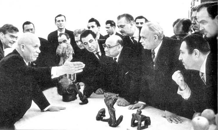 At 1962 Moscow art exhibit, Soviet Premier Nikita Khrushchev, left, denounced works by Russian sculptor Ernst Neizvestny, right with fist clenched, who defiantly responded that art under Stalin was “rotten” like his regime. Neizvestny’s Masks of Sorrow monuments are dedicated to millions who died in Stalin’s Gulag.