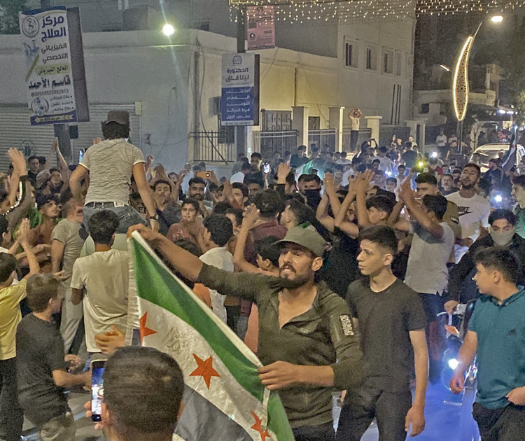 Residents of Azaz, northern Syria, celebrate Sept. 28 after learning of death of Hezbollah leader Nasrallah. The Tehran-backed group is hated by millions for helping the Assad dictatorship, along with Tehran and Moscow, crush popular rebellion that began in 2011.