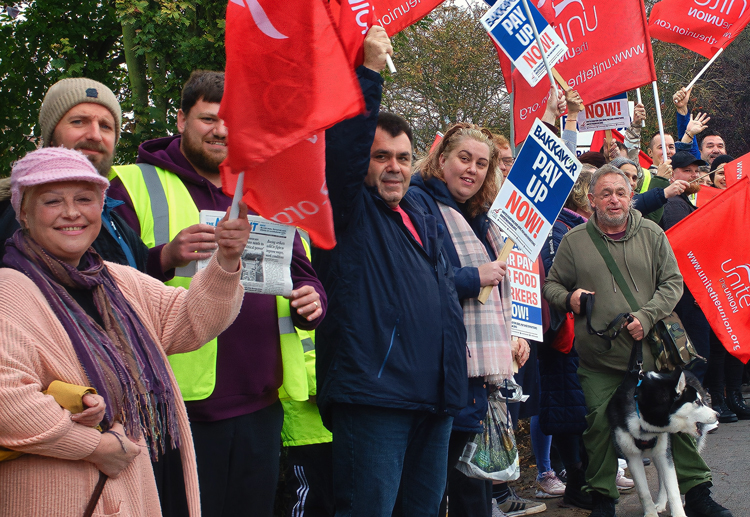 Unite union members picket Oct. 15 demanding higher wages at Bakkavor in Spalding, England. Strikers have called solidarity march from the picket line to the town center for Oct. 22.