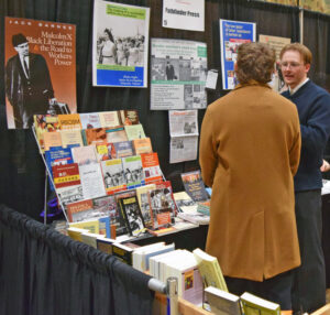 Vincent Auger, SWP candidate for Washington governor, introduces Militant, books by SWP, other revolutionary leaders, at Portland Book Festival Nov. 2.