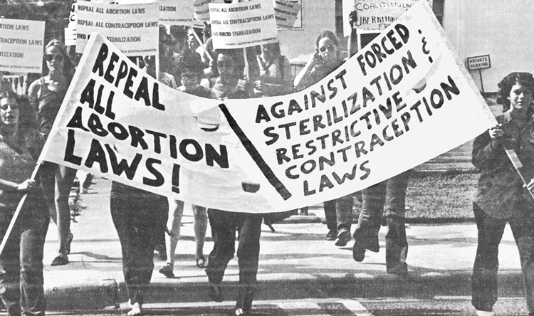 Top, March 2023 rally, Bridgeport, Connecticut. Above, 1971 march in Austin, Texas. As more women joined the workforce, women and allies demanded equal pay for equal work, expansion of child care access, end to involuntary sterilizations, repeal of laws criminalizing abortion. 