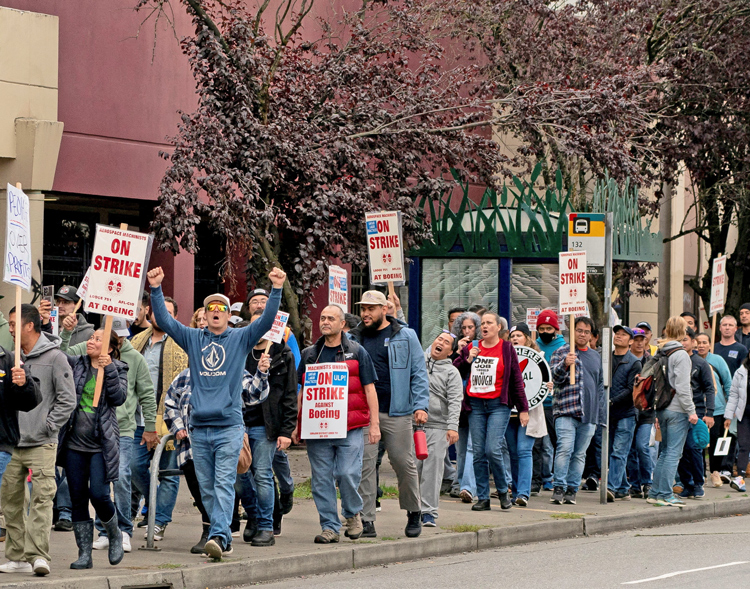 Boeing Machinists march after rally in Seattle Oct. 15. Workers won a 38% wage increase. “The strike gave Boeing a taste of what we’re capable of,” one worker told the Militant.