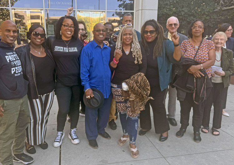 Family and supporters of Carlos Harris at Santa Clara County courthouse Oct. 17 after judge ordered his release after serving 20 years for crime he never committed. In front row, third from left, is Harris’ cousin, Aisha Hampton. Harris’ mother, Rachel Hampton, is fifth from left.