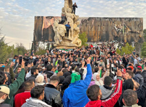 People in Aleppo, Syria, Dec. 8 celebrate fall of brutal Bashar al-Assad regime. Israel’s blows to Hezbollah and Iranian forces, and the weakening of Moscow by Ukrainian resistance to its invasion, left Assad’s unpopular government to collapse in face of the weeklong rebel uprising.