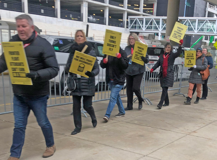 Association of Flight Attendants members picket Frontier Airlines at O’Hare airport Dec. 11. “This is the first day of action we’ve had in Chicago,” said AFA Local 86 President Brianna Whelan. Actions took place at Frontier locations in Atlanta, Denver, Las Vegas and Orlando.