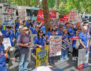 Nurses rally in Sydney, Australia, Nov. 26, part of 24-hour strike at hospitals throughout New South Wales. Workers are fighting for 20% pay raise over three years and hiring more workers.