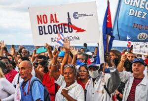 Half a million Cubans march past U.S. Embassy in Havana Dec. 20 protesting Washington’s over 60-year-long economic war against Cuba, listing country as “state sponsor of terrorism.”