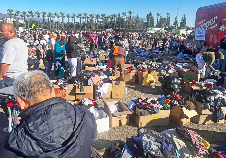 Near Los Angeles Eaton fire, hundreds brought donations Jan. 13 to Santa Anita racetrack lot in Arcadia. Fire victims could get things they needed from army of volunteers there.