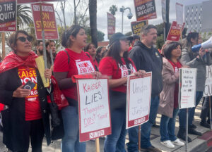 Striking health care workers rally against Kaiser