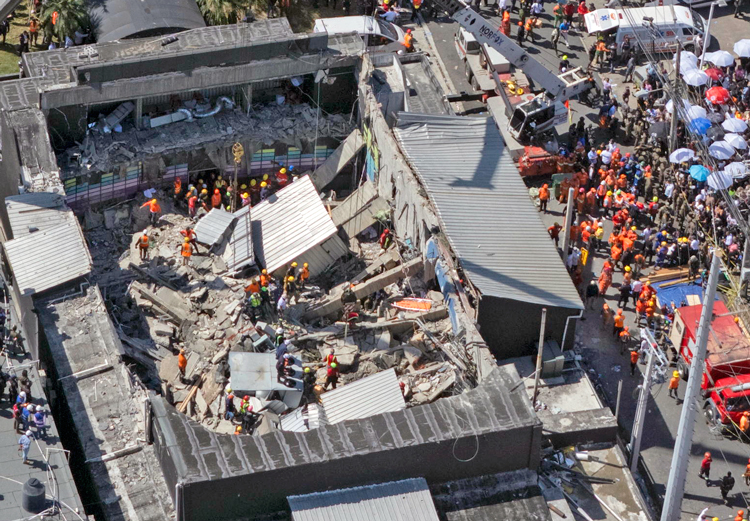 Rescue workers search for survivors after nightclub roof collapsed in Dominican Republic April 8. Government allowed “building practices that lead to these disasters,” said Jesús Núñez.