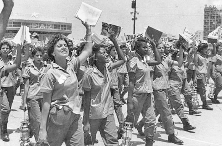 Literacy brigade volunteers in Havana, 1961. Mass literacy campaign closed gap between town and country, cemented worker-peasant alliance, advanced road to Cuba’s socialist revolution.