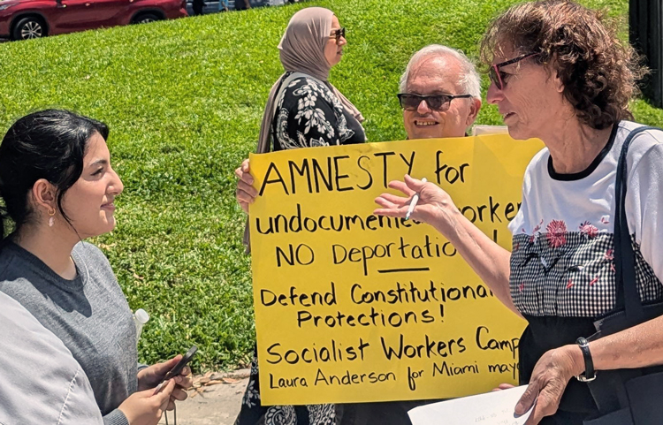 In Miami, Rachele Fruit, right, and Chuck Guerra, supporters of SWP mayoral candidate Laura Anderson, discussed demand of amnesty for immigrants at “National Day of Action” April 19.