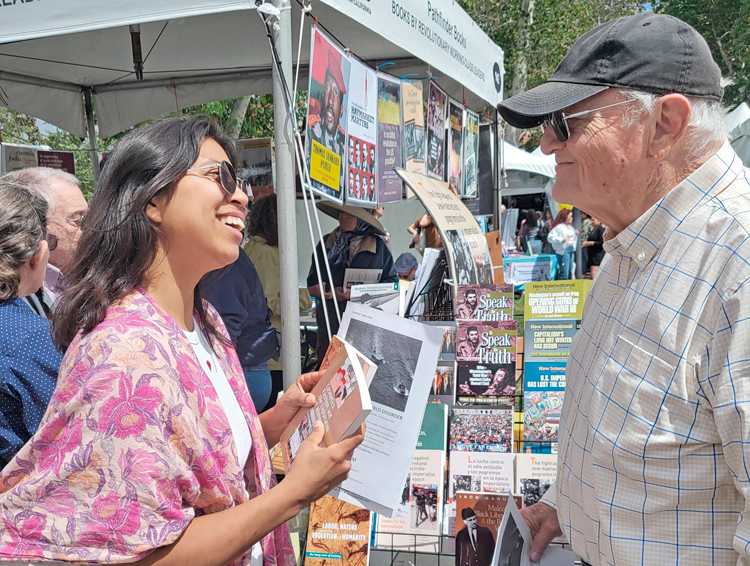 At Los Angeles Times Festival of Books April 27, Middka Vicencio, a museum worker, asked Norton Sandler, SWP candidate for California governor, “How can we bring about real change?”
