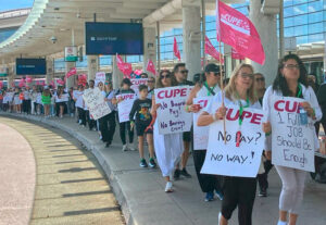 Some 10,000 flight attendants in the Canadian Union of Public Employees struck Air Canada Aug. 16, defying a government back-to-work order for three days. Above, picket line in Toronto.