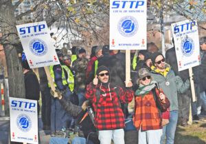 Canada Post workers picket outside sorting plant in Montreal, Nov. 15, 2024. Government ordered them back to work after four weeks, as it had done to striking rail and port workers.