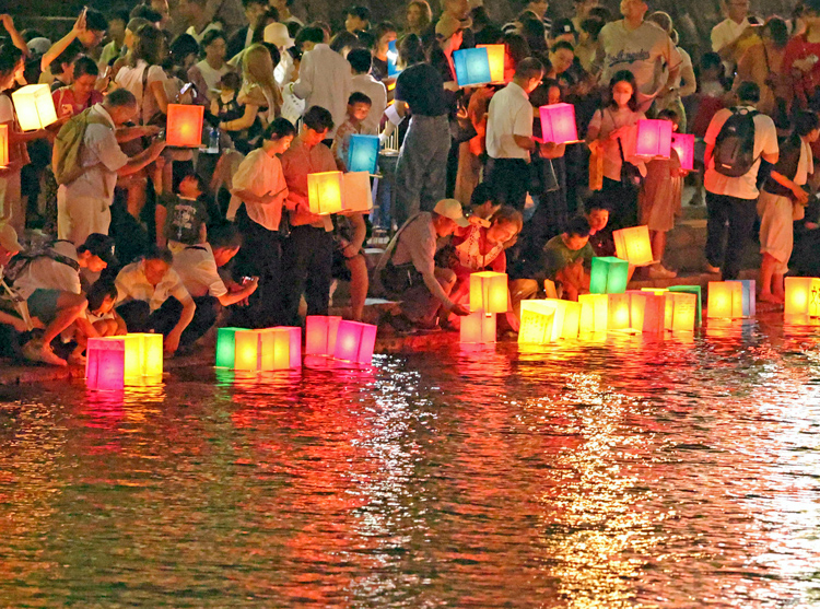 On the 80th anniversary of the Hiroshima atomic bombing on Aug. 6, 1945, lanterns floated down the Motoyasu River near the Hiroshima Peace Memorial Park in Japan. The names of 344,306 of those who died from U.S. nuclear attack and its aftermath are displayed there.