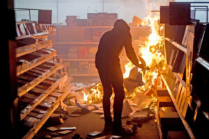 Following 2020 killing of George Floyd, thugs destroy Office Depot in St. Paul, Minnesota, during a wave of riots and looting. Explosion of violent attacks is dangerous for the working class.