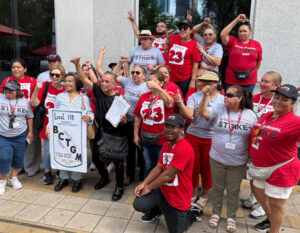 Striking members of UNITE HERE Local 23 at Hilton Americas-Houston hotel Sept. 20. Bringing messages of solidarity are members of BCTGM Local 111 at Bimbo in Grand Prairie, Texas.