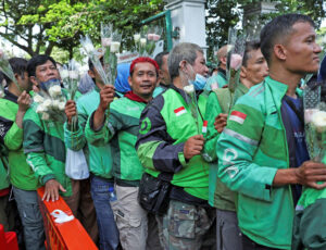 Delivery workers in Indonesia join anti-government protest Sept. 2. When a delivery worker was killed by police, workers in nearby countries responded by donating food orders to drivers.
