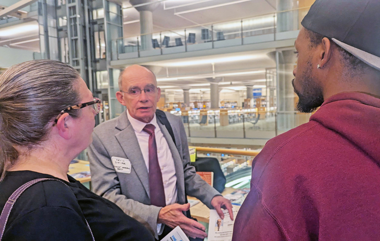Kevin Dwire, center, Socialist Workers Party candidate for Minneapolis mayor, after speaking at League of Women Voters debate Sept. 9. The working class needs its own party, he said.