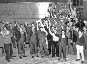 Omaha, Nebraska, June 1937. Strikers celebrate as first truck leaves with a union driver after they won a contract at Arrow Motors Freight. Victory was result of a drive, led by Minneapolis Teamsters, that in a few years organized a quarter million over-the-road truckers in 11 states.