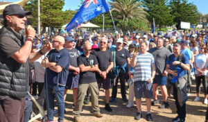 Over 2,000 Jews and opponents of Jew-hatred joined a rally at Bondi Beach in Sydney September 7, protesting against provocative anti-Israel mobilization nearby. Speaking is musician Hylton Chilchik.