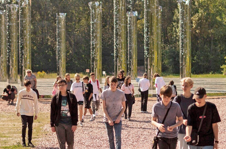 Students visiting the Mirror Field memorial installation, part of Babyn Yar Holocaust Memorial in Kyiv. “For the Jewish youth who go today to Auschwitz, I hope they will also come to Babyn Yar. It is not less important to remember the ‘Holocaust by Bullets,’” Natan Sharansky said.