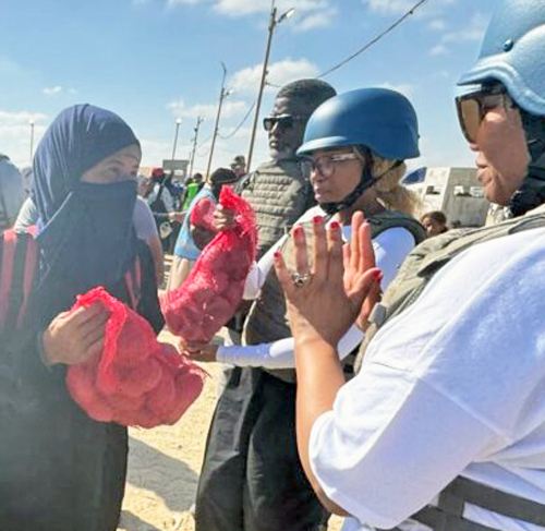 Nelson Mandela’s granddaughters Zamaswazi Dlamini-Mandela (center) and Zaziwe Dlamini-Manaway at aid site in Gaza during visit to Israel. “Seeing how families were murdered for simply being Jewish will stay with us forever,” Dlamini-Manaway said.