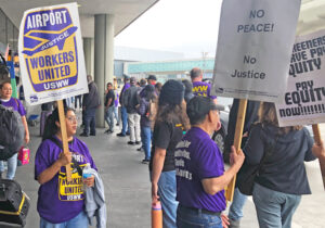 Airline cabin cleaners picket San Francisco International Airport Oct. 22, after 14 workers were suspended for trying to meet with bosses over unsanitary working conditions, back pay.